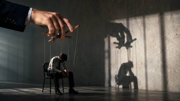 Man being used as a string puppet by his boss.